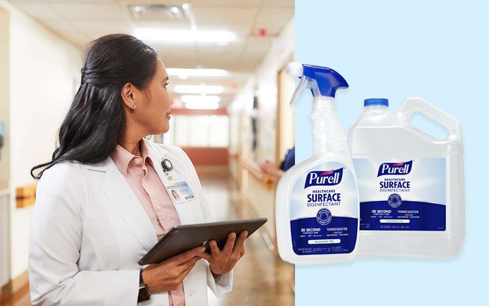 Female physician holding an iPad next to Purell's new surface sanitizing spray